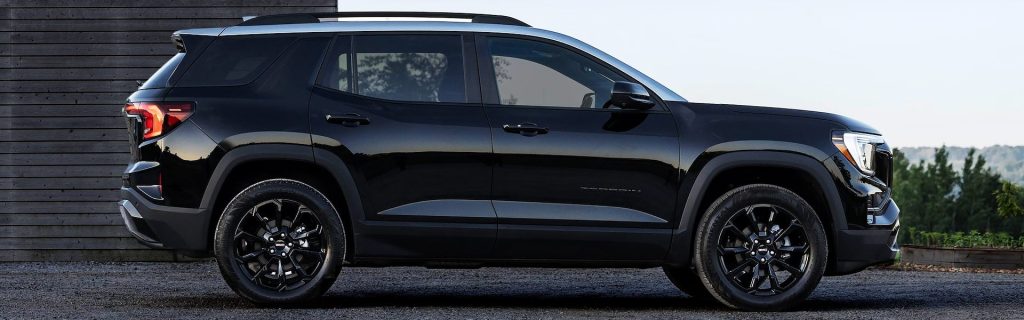 2025 GMC Terrain Elevation parked in front of a house