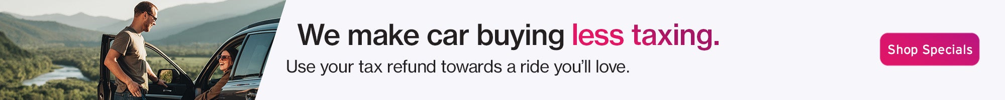 People standing by a parked SUV with tax refund car offer message